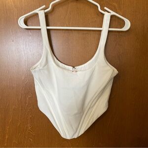 White Fox Corset top with a small pink flower. Size XS